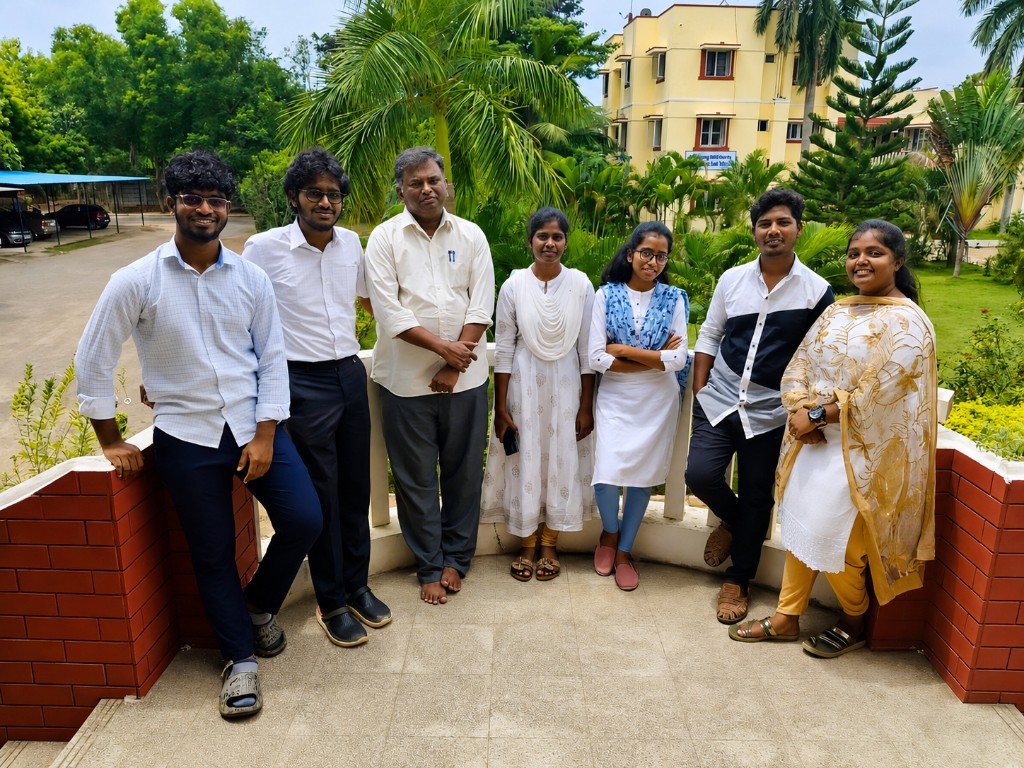 Learning in Action - Students and faculty on campus terrace